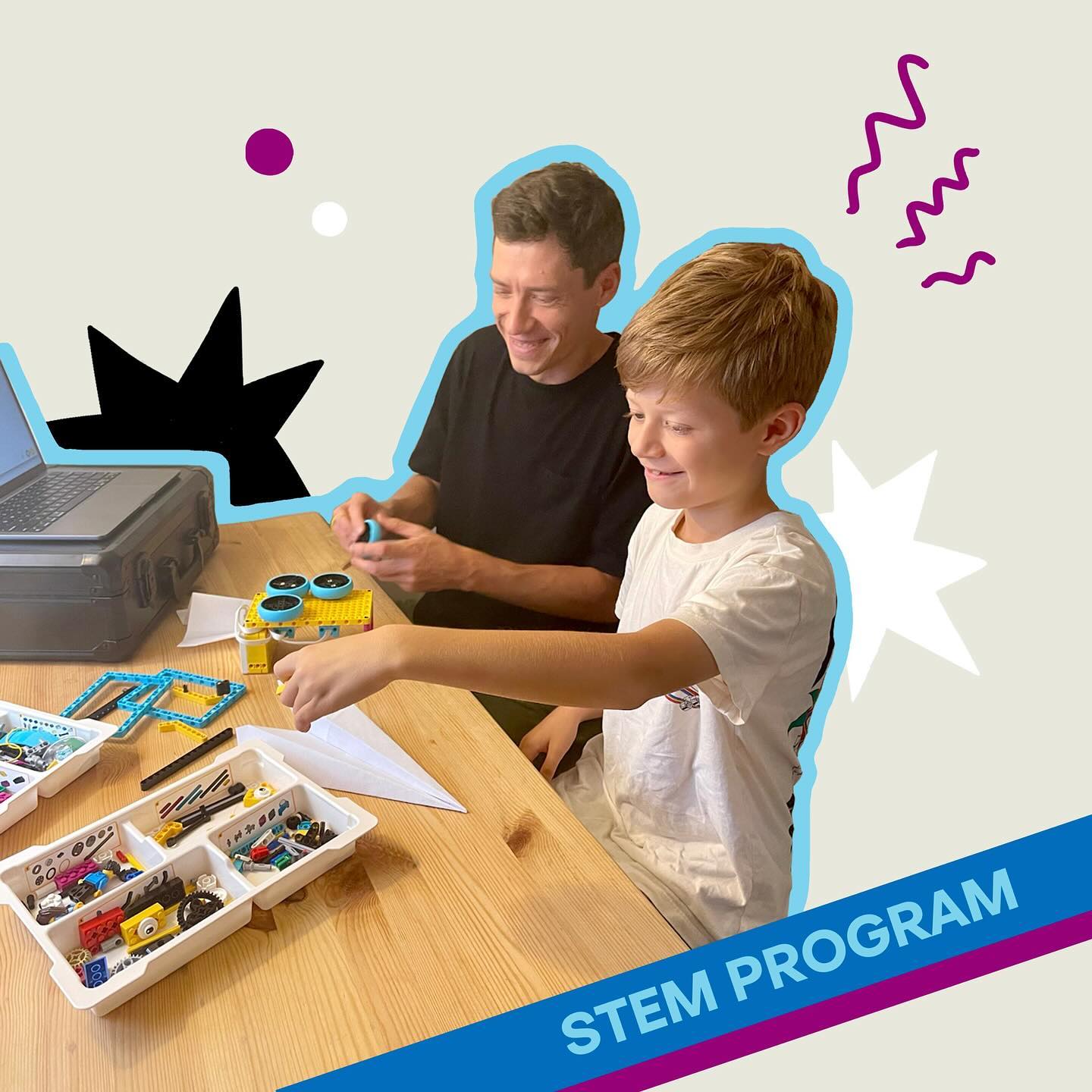 Tony teaching robotics with a student